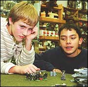 Alex Curlin and Joey Quigley play in a WarHammer tournament